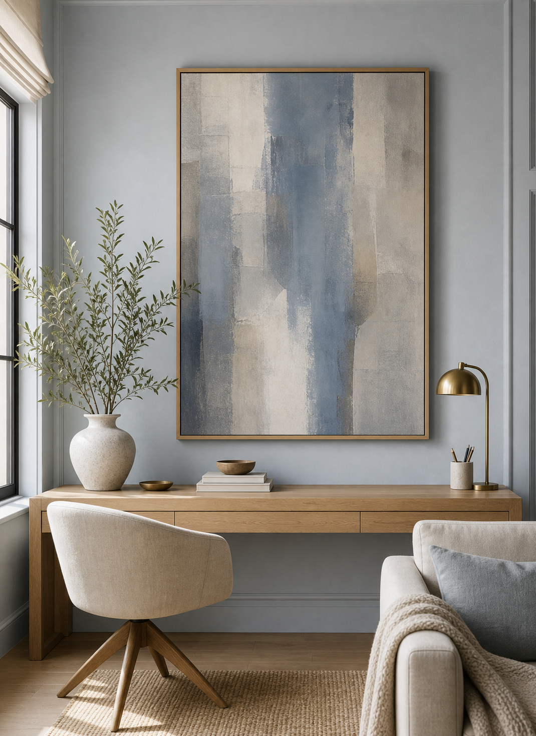 Dusty blue artwork styled in a finished room
