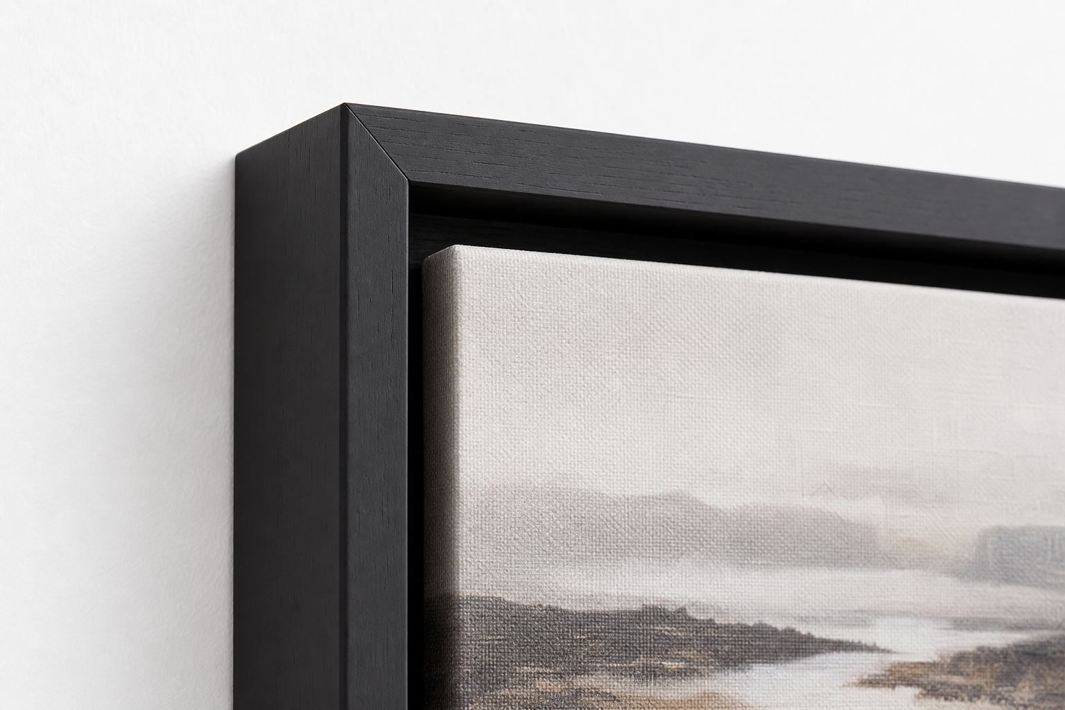 Black floating frame corner with visible recessed canvas gap